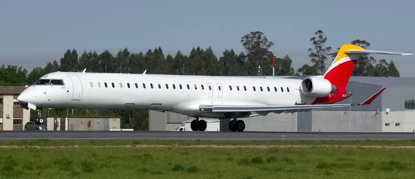 Bombardier CRJ Series 700-900 parked at an airport waiting for its passengers