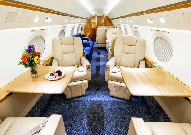 Interior design of the Gulfstream GV with tables deployed.