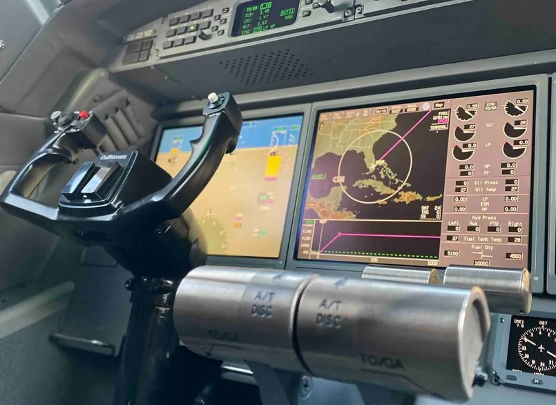 A close-up of the center console and the engine instrument and crew alerting system (EICAS) display screens in the G550 cockpit.