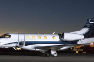 Embraer Phenom at the night parked at the airport