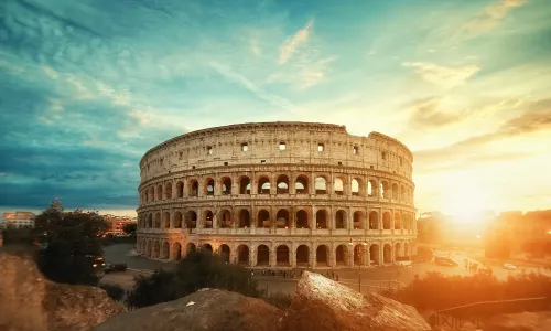 Beautiful photo of the famous Roman Colosseum amphitheater under the stunning sunrise sky