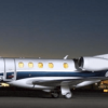 Embraer Phenom at the night parked at the airport