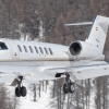 Learjet airplane flying through the snow