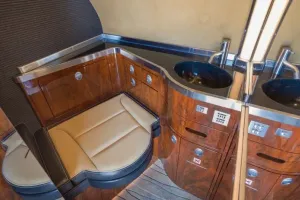 Forward crew lavatory in Bombardier Global XRS, equipped with sink and vanity for crew use