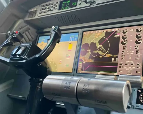 A close-up of the center console and the engine instrument and crew alerting system (EICAS) display screens in the G550 cockpit.